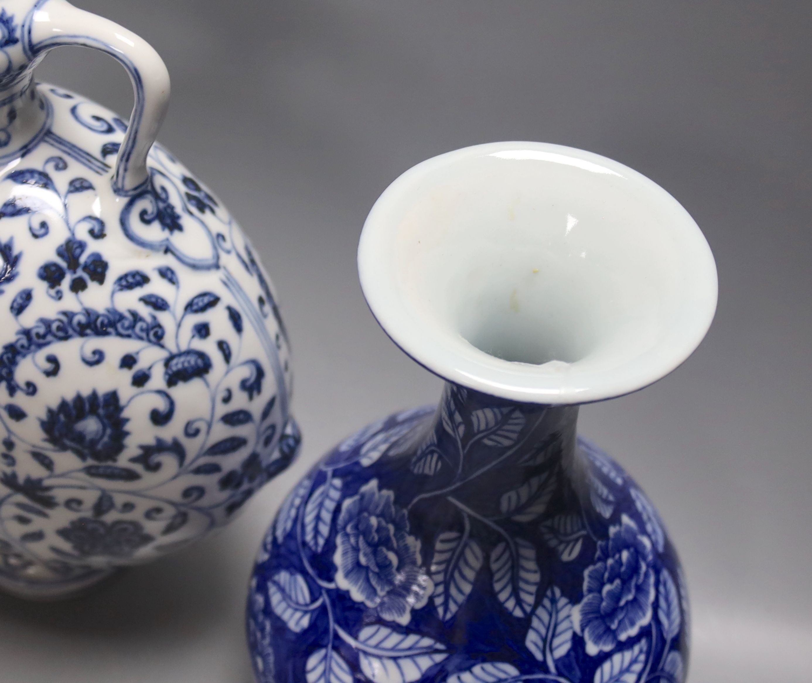 Two Chinese blue and white vases and a similar moon flask, moon flask 28 cms high.